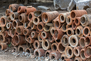 Stack of ancient terracotta plumbing pipes from Ephesus, evidence of advanced Roman engineering....