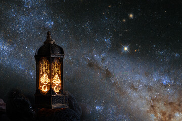 Eid al Adha, traditional Arabic lantern on the background of the star sky, Festive decoration for Eid, Element of the image provided by NASA