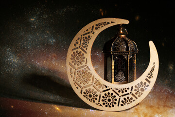 Eid al Adha, traditional Arabic lantern on the background of the star sky, Religious festival celebration, crescent moon, night prayer,Element of the image provided by NASA
