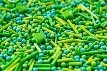 The texture of candy sprinkles.Varied sugar sprinkles, stars, flowers, dots.Holiday treat.Toppings for donuts,cupcake, desserts and ice cream .