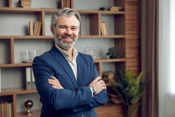Handsome professional man psychologist with beard posing with crossed arms