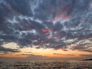 Dramatic sunset sky with clouds. Dramatic sunset over the sea.
Colorful clouds.
Sun and sea.
Dark...