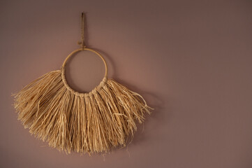Raffia handmade wall decoration in the living room 