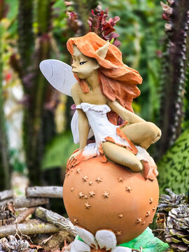 Fairy, Close up shot of elf statue in the forest.