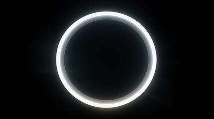 A glowing white circle on a black background.