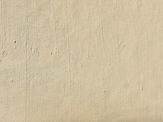 The plain beige cement wall texture