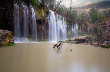Beautiful waterfalls over emerald water in deep green forest in Kursunlu Natural Park, Antalya, Turkey