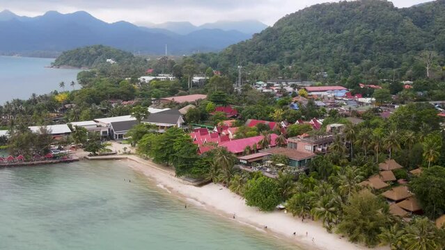 Aerial View Along Kai Bae Beach Coastline With Resort And Hotels. Orbit Motion Shot
