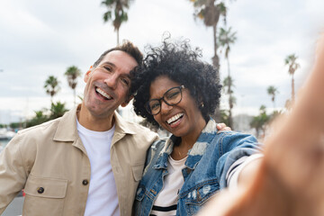 Self selfie portrait of African American woman and caucasian man couple 