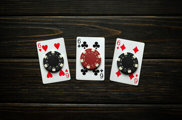 A gambling game of poker with a lucky winning combination of three of a kind or set. Playing cards...