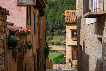 Old charming streets. Typical village with stone facades. Architecture and sights of Spain.