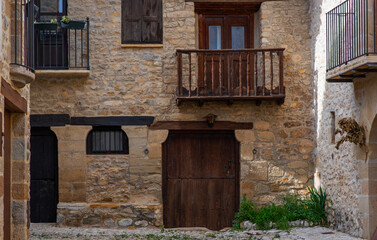 Old charming streets. Typical village with stone facades. Architecture and sights of Spain.