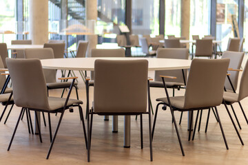 
chairs and round tables in the restaurant