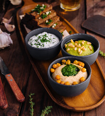 Gourmet beer snack platter with dips and toast