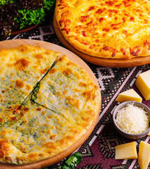 Savory cheese pizza or khachapuri on rustic table setting