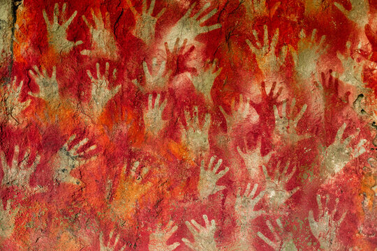 Reconstruction of Prehistoric, paleolithic cave paintings, art with hands prints.