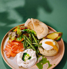Gourmet breakfast platter with poached eggs and salmon