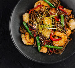 Asian stir-fried noodles with shrimp and vegetables
