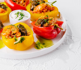 Colorful stuffed bell peppers on white plate