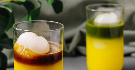 Tropical ice ball cocktail on modern countertop