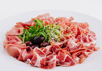 Assorted deli meats plate with garnish