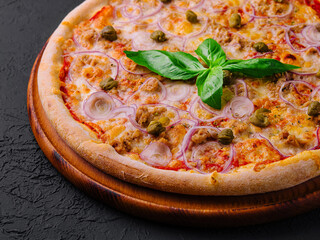 Fresh italian pizza on wooden board
