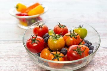 Tomato isolated on wood table background. close-up, front view, top view,