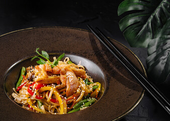 Asian-style stir fry noodles with vegetables and chicken