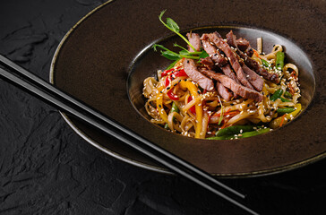 Gourmet asian beef stir fry on elegant plate