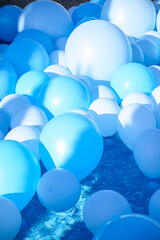 Large inflatable blue balls in the pool