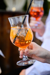 Apperol cocktail in hands