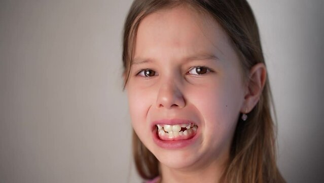 Close up upset cute girl looking sad crying on camera
