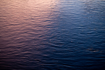 river texture background Evening sunset is Divided into two beautiful colors There are red and blue.