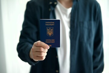 citizen of Ukraine with a Ukrainian passport in his hands