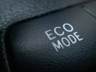 selective focus eco mode lettering on the car console