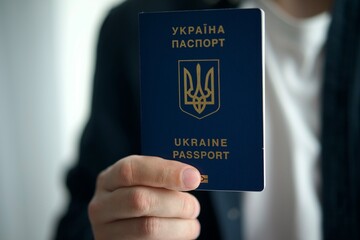 Ukrainian passport in the hands of a person close-up