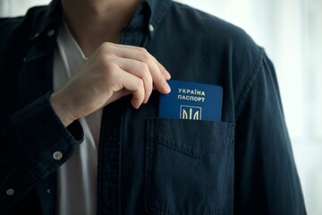 citizen with a Ukrainian passport in his hands