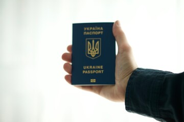 Ukrainian passport in the hands of a man