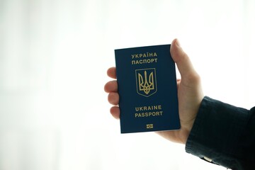 Ukrainian passport in the hands of a man