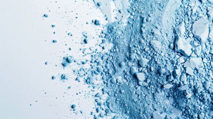 Crushed blue eyeshadow texture, blue powder scattered on a white background