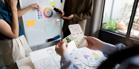 Brainstorm team of creative web graphic designer planning. Creative designers present ux ui to...