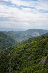 Fototapeta premium Ovcar and Kablar mountains new West Morava river in Serbia, view of natural park, rocks, trees and fields of grass. Protected Serbian natural park.