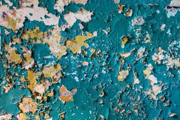 Industrial Background Of Azure Peeling Paint On The Old Rough Yellow Wall