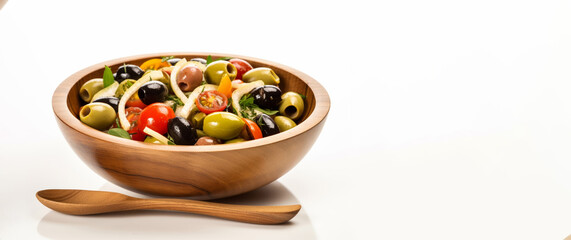 Set against a pristine white studio background, a wooden bowl showcases a colorful vegetable salad composed of tomatoes, cucumbers, lettuce, onions, olives, and bell peppers.