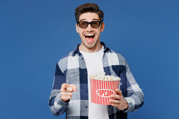 Young surprised man he wears shirt white t-shirt casual clothes 3d glasses watch movie film hold...