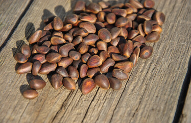 pine nuts on a wooden background close-up. 