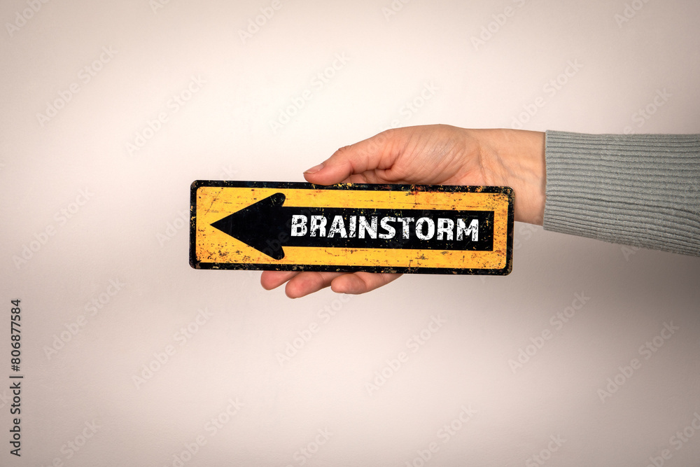 Canvas Prints brainstorm. arrow with text in woman's hand on white background