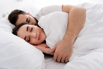 Photo of funny sweet husband wife nightwear cuddling sleeping indoors house bedroom