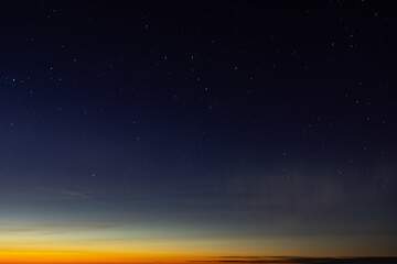 The sky with stars and the glow of the northern lights. Soft selective focus. Artificially created...