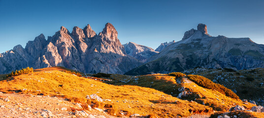 Great rocky massif in the Italian Alps on a sunny day. National Park Tre Cime di Lavaredo, Dolomites, Italy, South Tyrol.